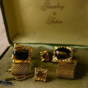 A complete vintage gentleman’s jewelry set by Faber, presented in the original “